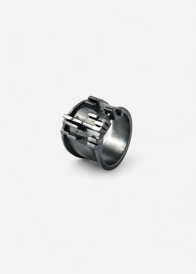 Wide darkened 925 silver ring, Brutalism V.3: raised rectangular bars across the face, bright edges against the dark band