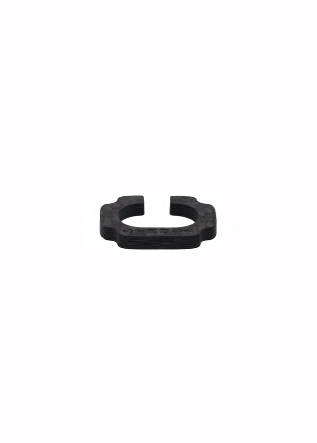 Open black carbon Blade ear cuff, squared corner tabs, layered carbon edge, STRUGA engraved, on white.
