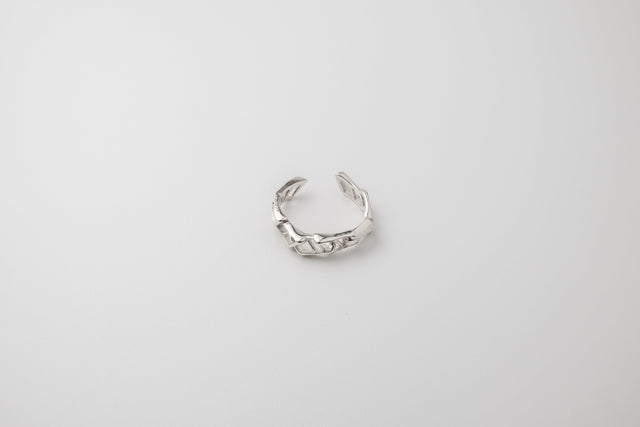 Polished 925 silver ring built as chain links: open band, faceted surfaces catching the light.