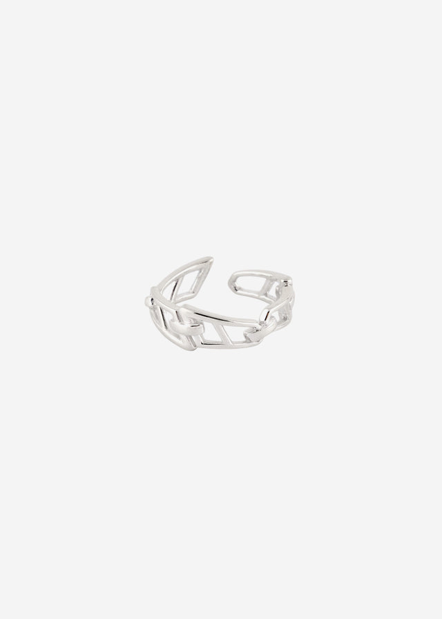 Open chain-link band ring in polished silver, angled studio shot on a pale grey backdrop — STRUGA